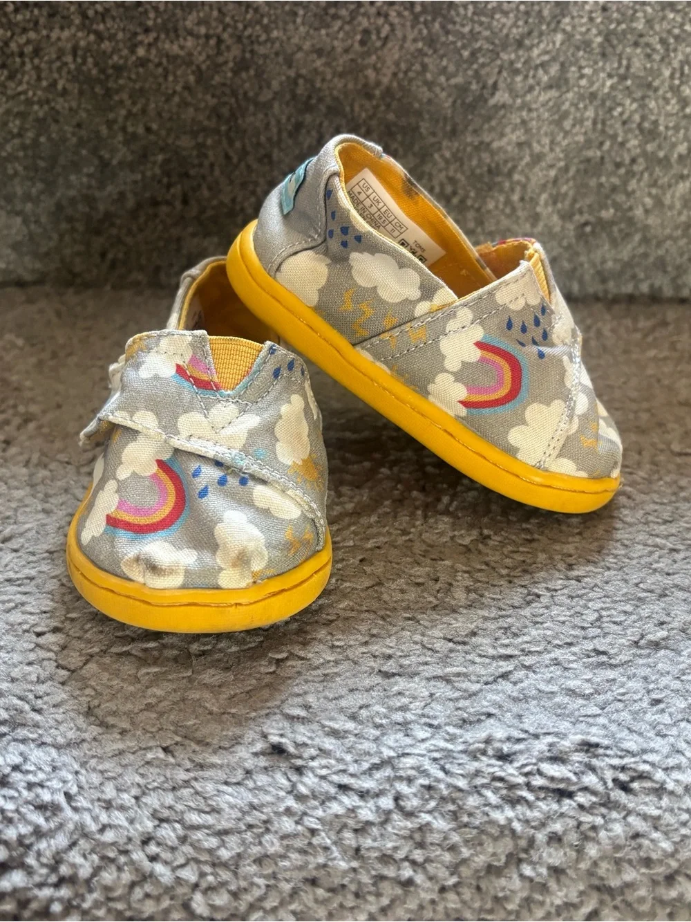 Toms Kids Slip-On Shoes in Gray with Yellow Soles and Rainbow Print